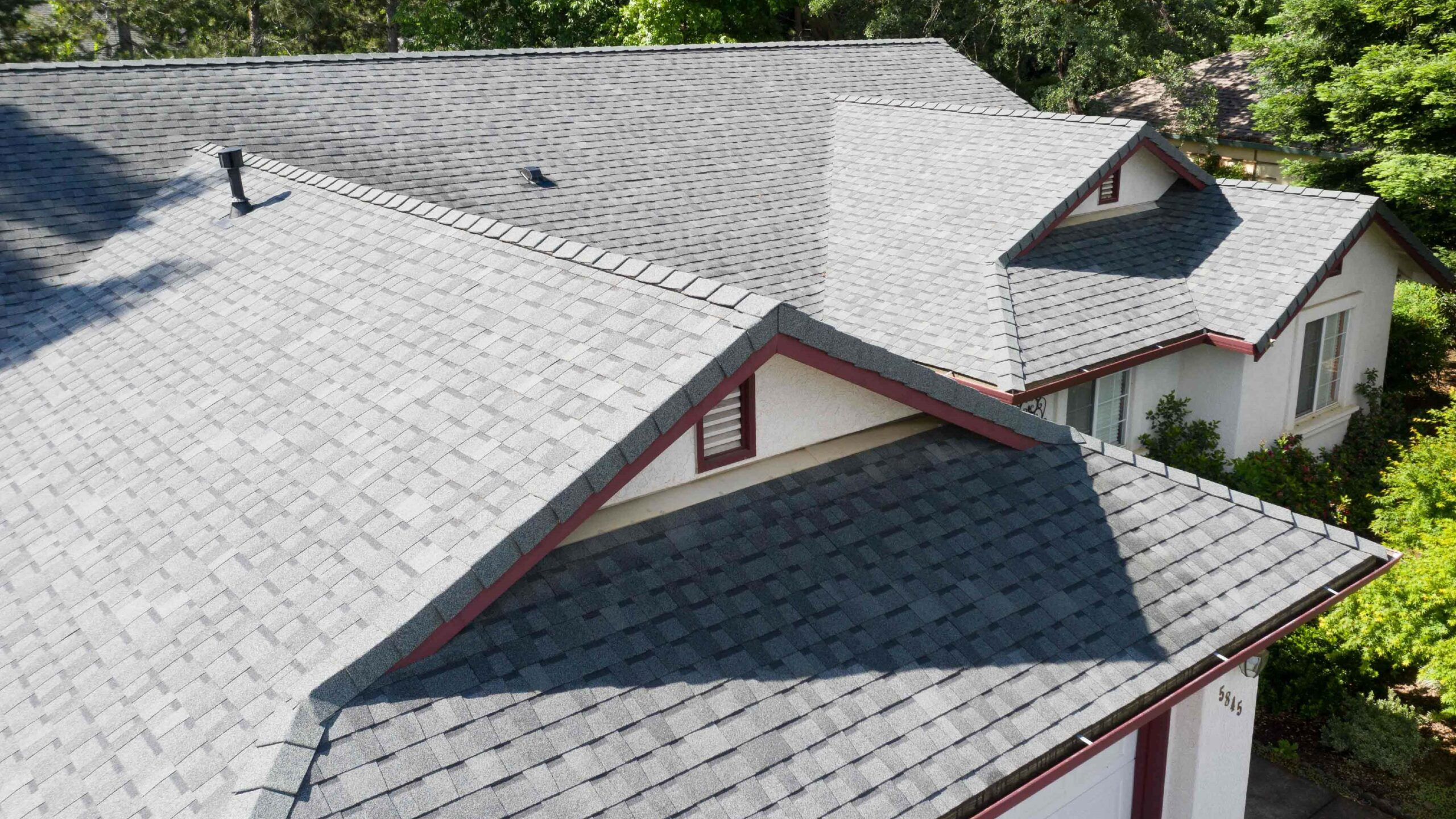 A roof with cool roof gray shingles (residential)